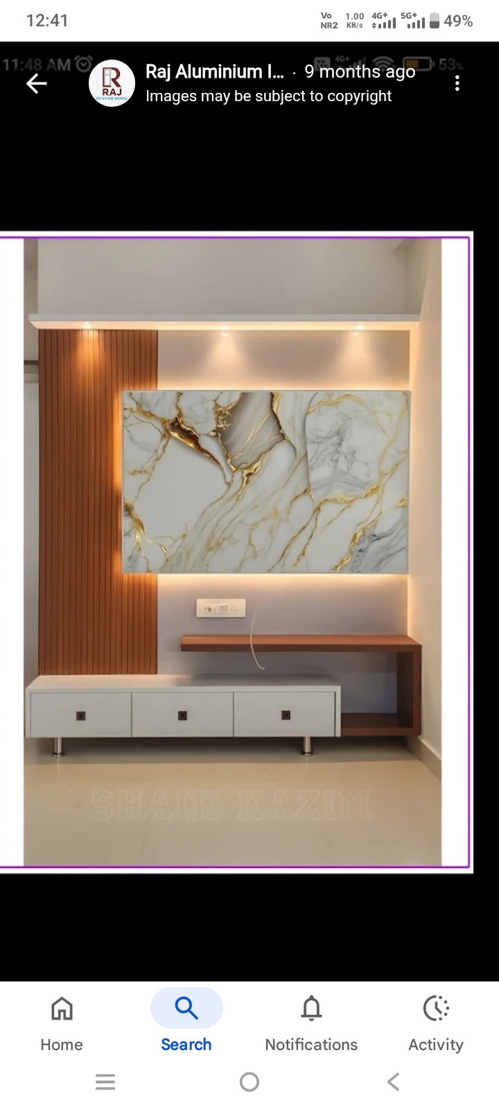 Illuminated TV wall unit with marble finish