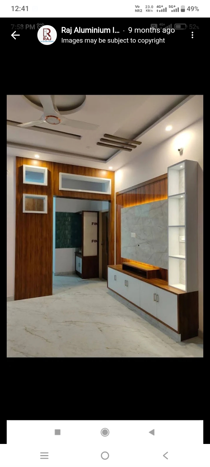Custom TV wall unit with wood finish and display cabinets