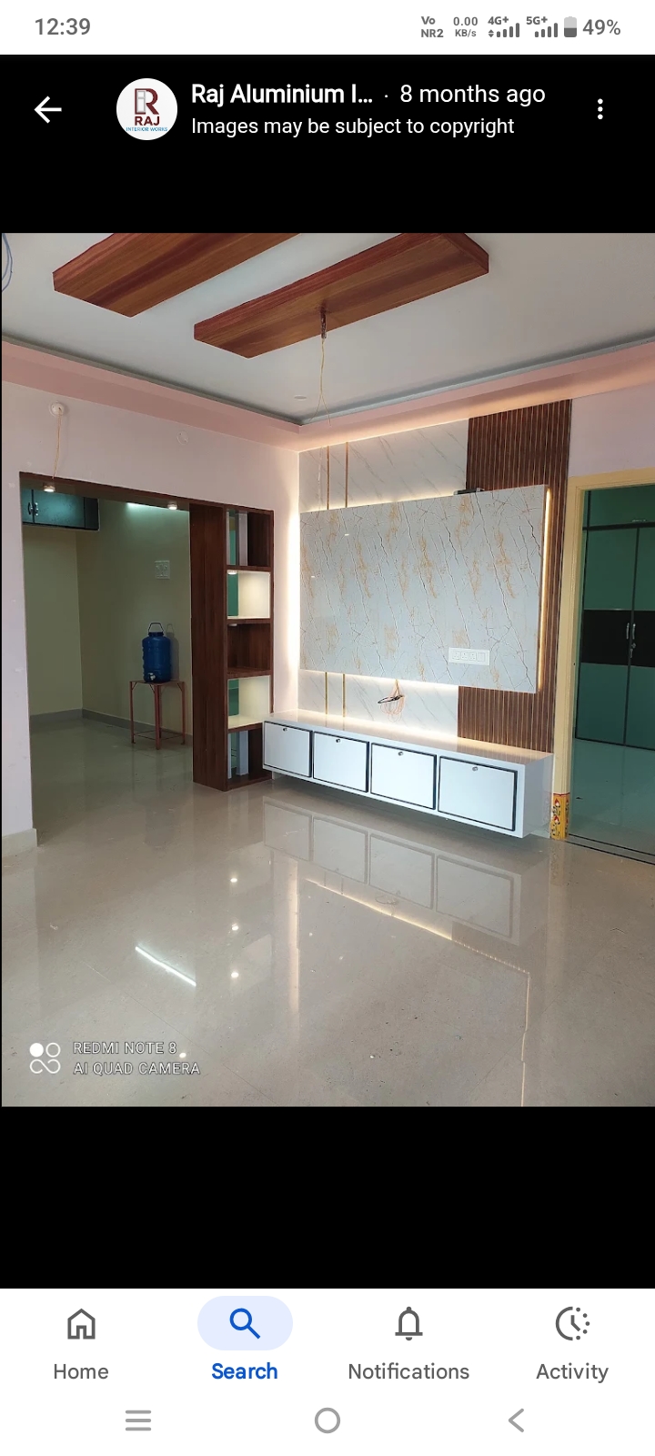 Wood-finish TV wall unit with white base cabinets